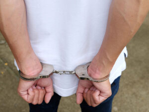 handcuffed youth
